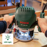 Bosch Home and Garden Oberfräse POF 1400 ACE (3 x Spannzange, Fräser, Parallelanschlag, Absaugadapter, Koffer (1400 W)) Grün