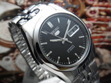 Seiko SNK361K1 5 Automatik schwarzes Zifferblatt Stahlarmband, Grau SEIKO 5 SNK361K SNK361